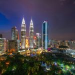 Aerial view of Kuala Lumpur Downtown, Malaysia. Financial district and business centers in smart urban city in Asia. Skyscraper and high-rise buildings at night.